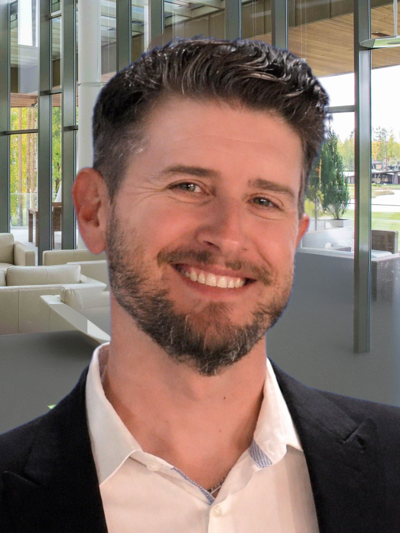 Headshot of Jeff Boron with chairs and windows in the background